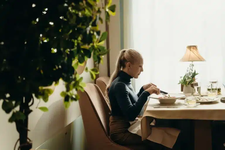 Casual dining restaurant table with appetizers and entrees in warm lighting