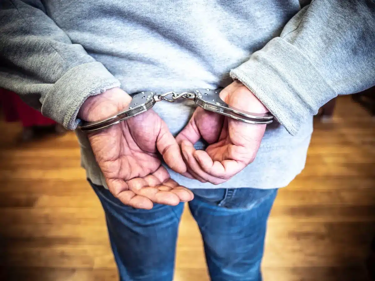 Police officers executing a search warrant at a residential property