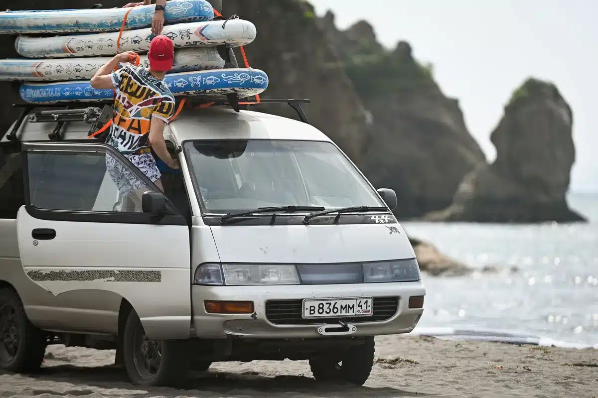 A band of young musicians in a van on a cross-country road trip