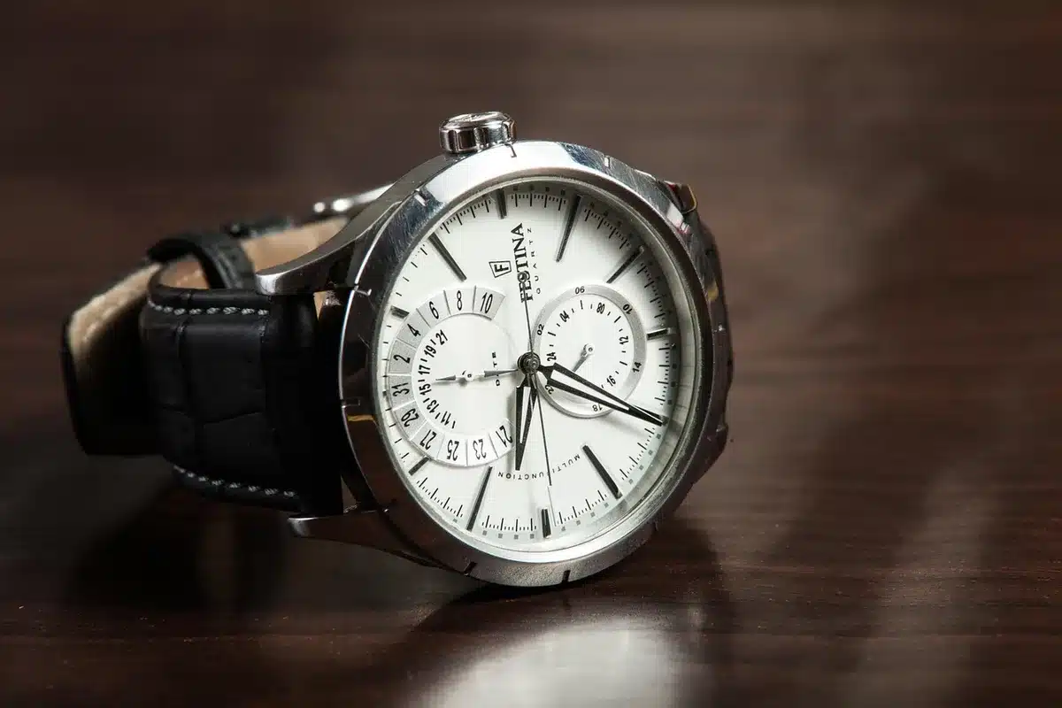 Luxury watch with detailed face and band shown in close-up with reflective lighting
