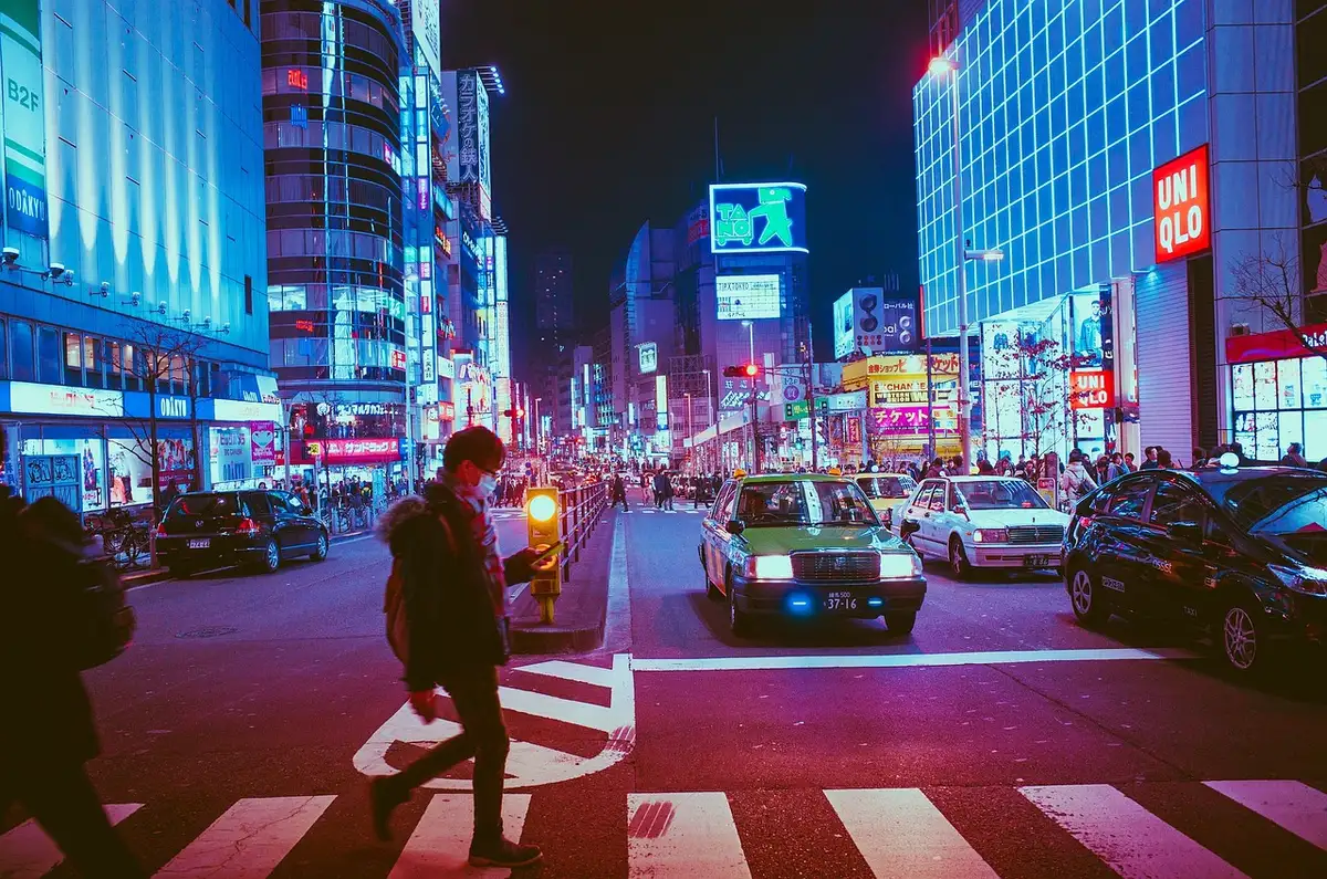 Silhouetted figure running through a neon-lit street at night, evoking pursuit and danger