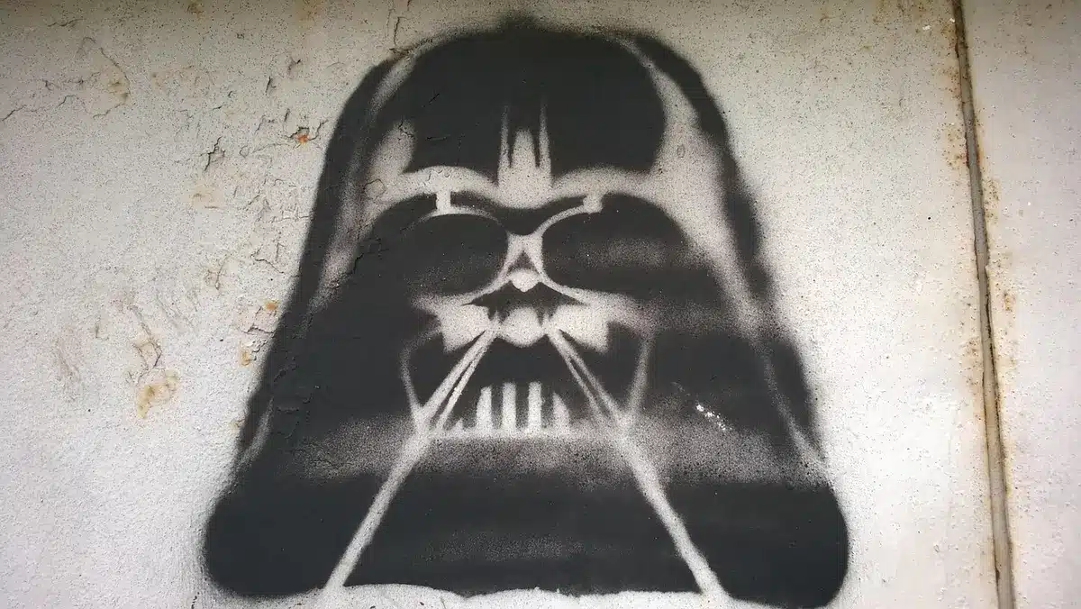 A dark helmet on a table suggesting a villain's presence