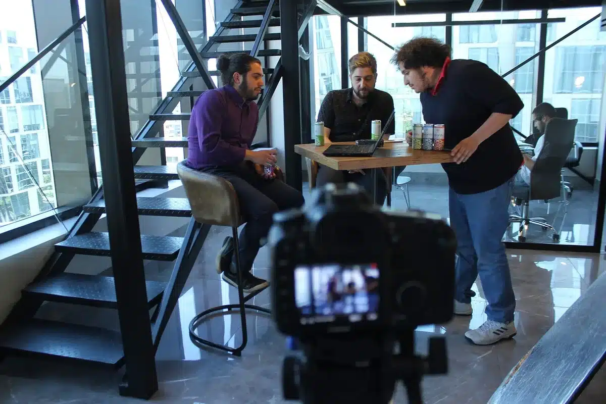A horror film director at work on a movie set with crew members
