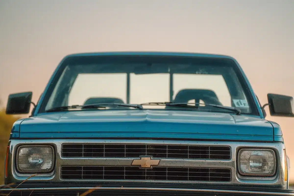 A bus speeding on a highway at sunset reminiscent of 1990s action films
