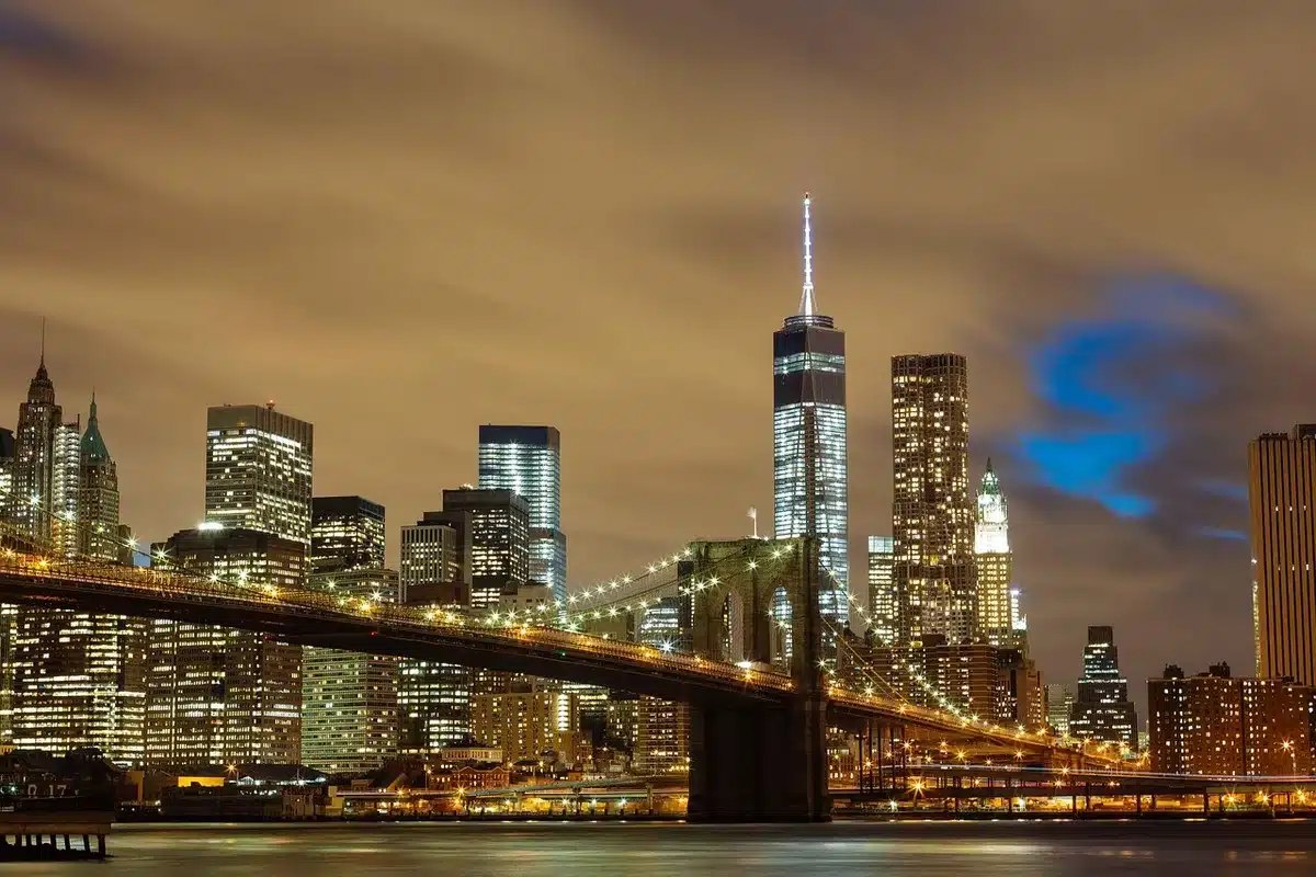 Night-time cityscape with distant lights and urban silhouettes