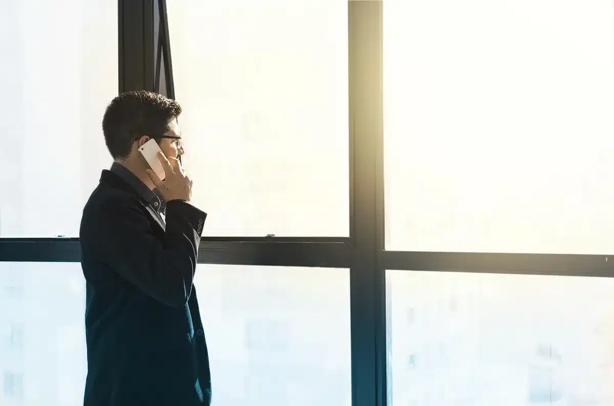 Entrepreneur looking at financial documents with worried posture