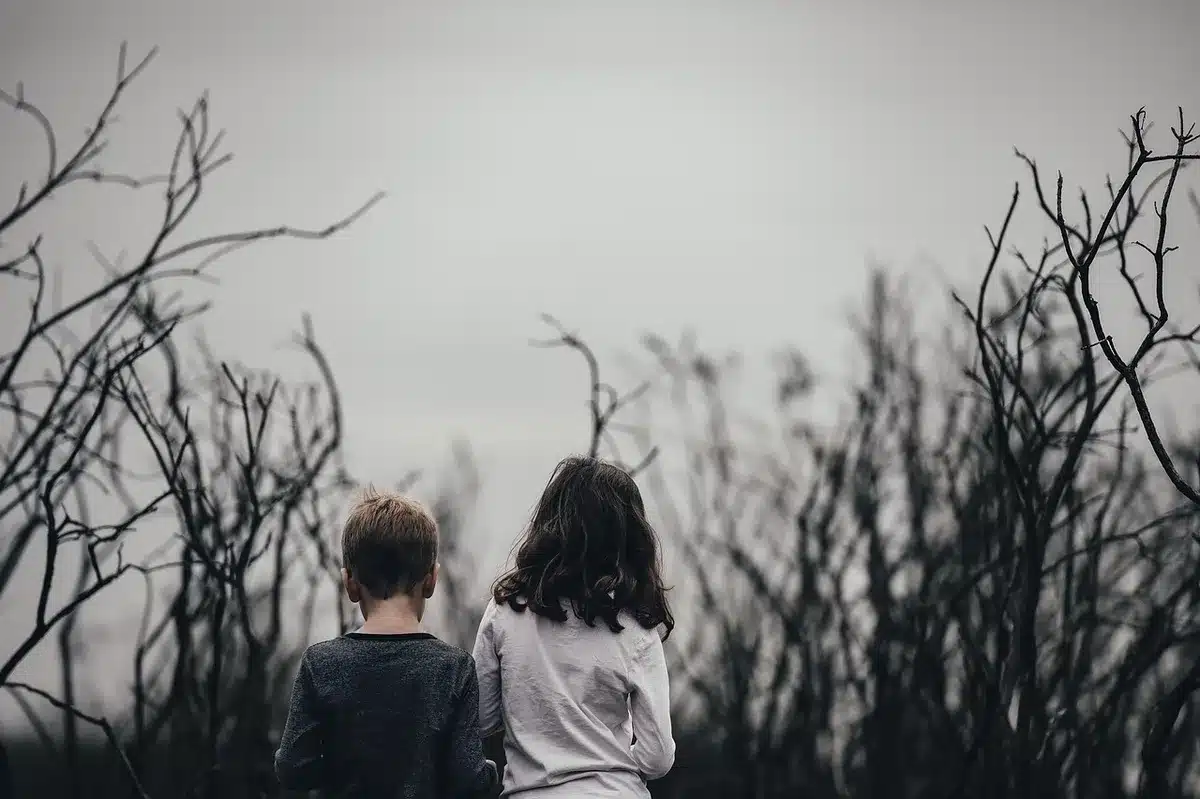 Silhouetted sisters on a film set symbolizing sibling relationship
