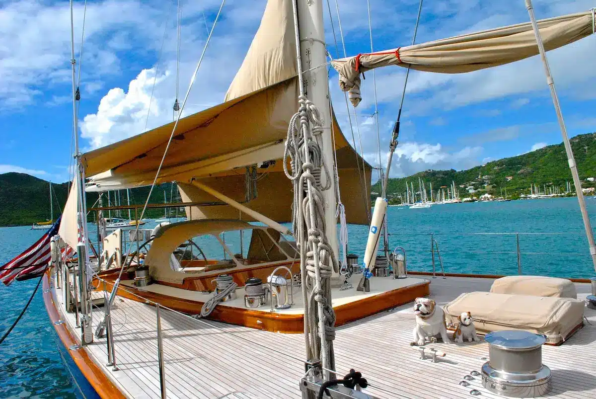 Anonymous yacht crew in briefing on deck with captain silhouette