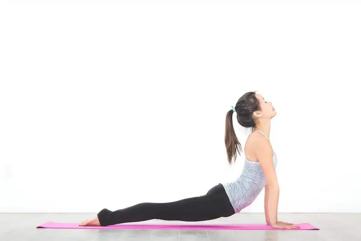Athlete stretching and checking muscles to illustrate listening to the body