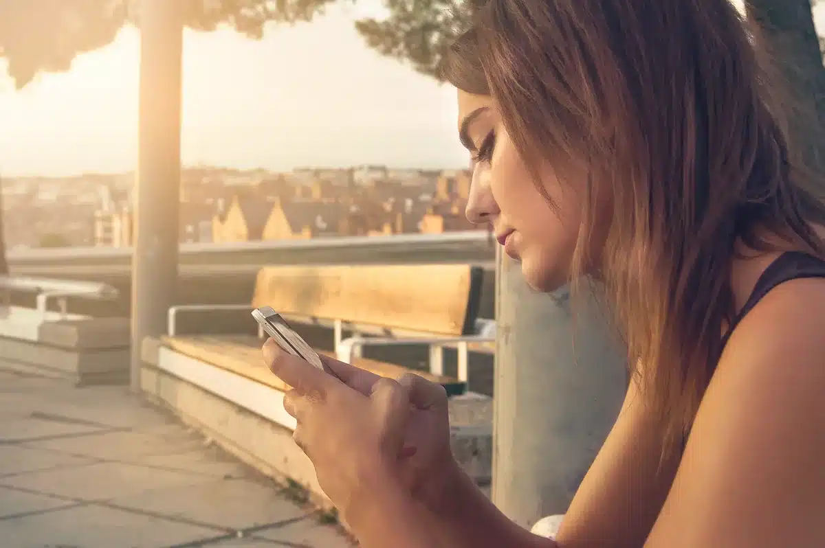 Parent and child looking at a smartphone together